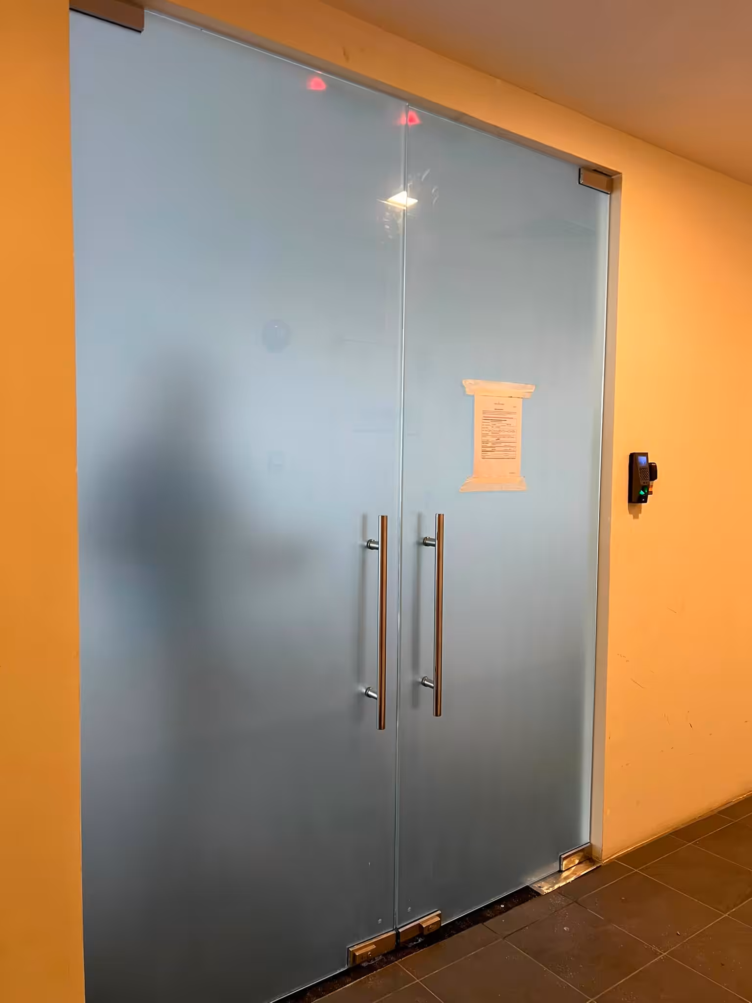 Frosted film blocking clear views through office glass partitions